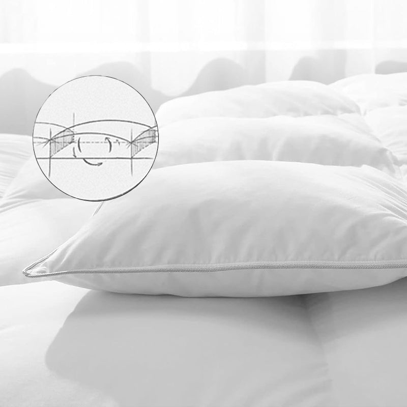 Close-up of a white APSMILE down comforter, featuring a cutaway view within a circle to demonstrate the internal structure.