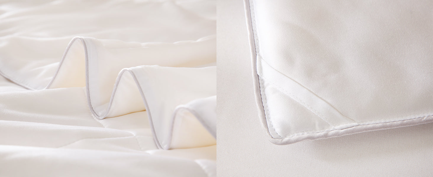 Close-up of an APSMILE bamboo fiber comforter, showing textured, folded fabric with light gray piping, and a corner detail with reinforcing stitching.