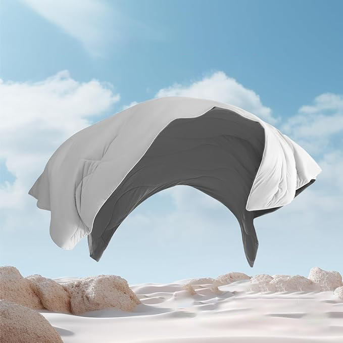 APSMILE cooling blanket suspended over a sandy surface against a sky with clouds.