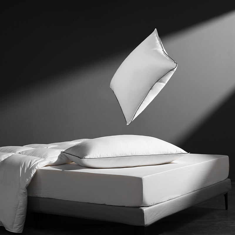 APSMILE Feather pillows float on top of the bed for a fluffy texture.