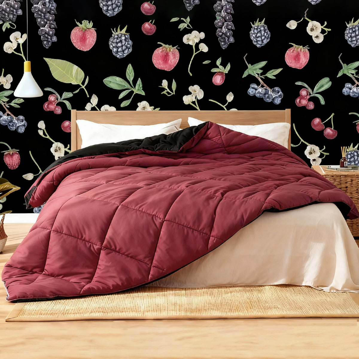Raspberry red and charcoal black down alternative comforter made with vegan soft™ quilted fabric, filled with eco - friendly recycled Climaloft microfiber, and using double - sided low - impact dye, placed in a room with fruit - patterned wallpaper.