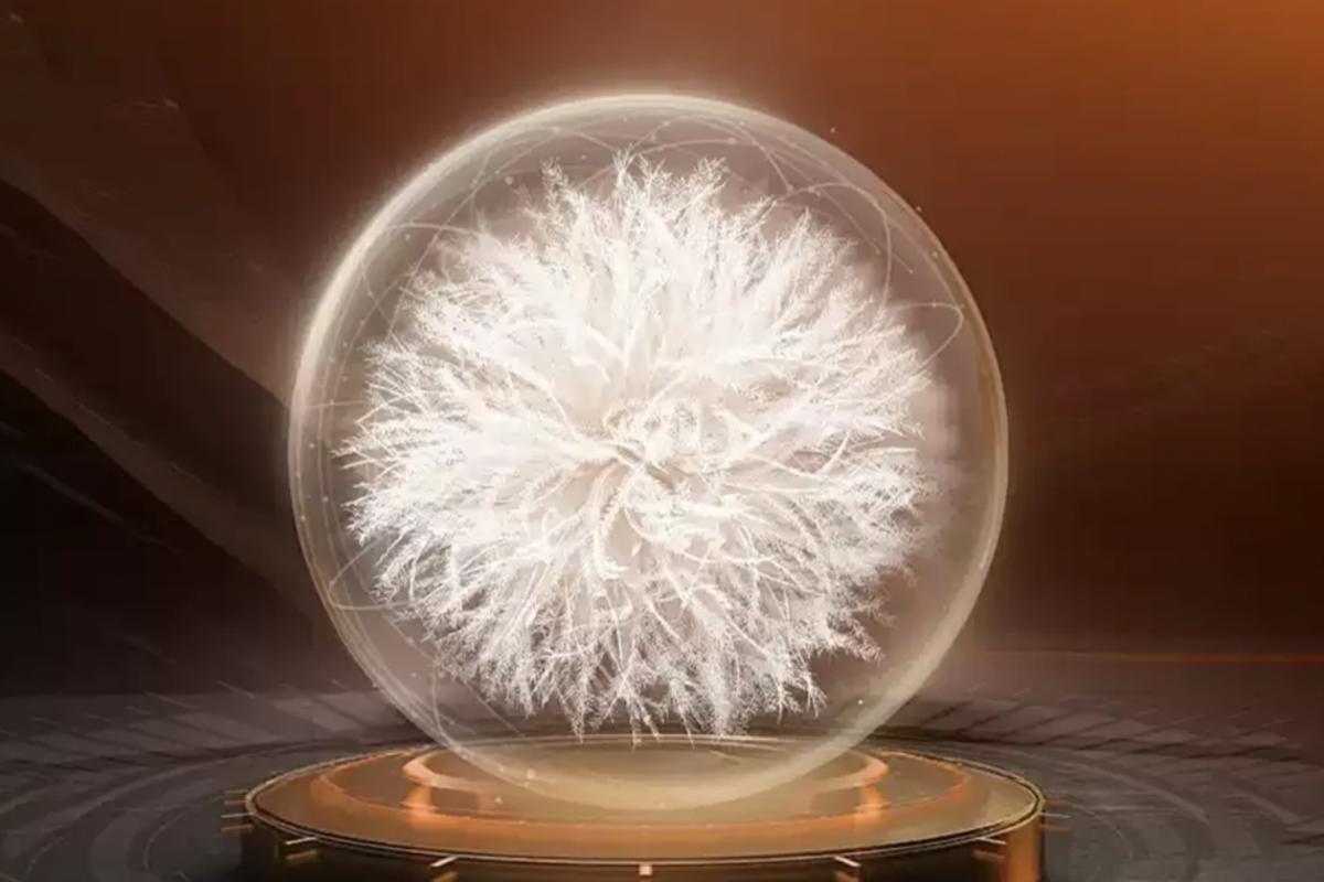 There is a down feather - like structure inside a transparent sphere, placed on a base with golden decorations