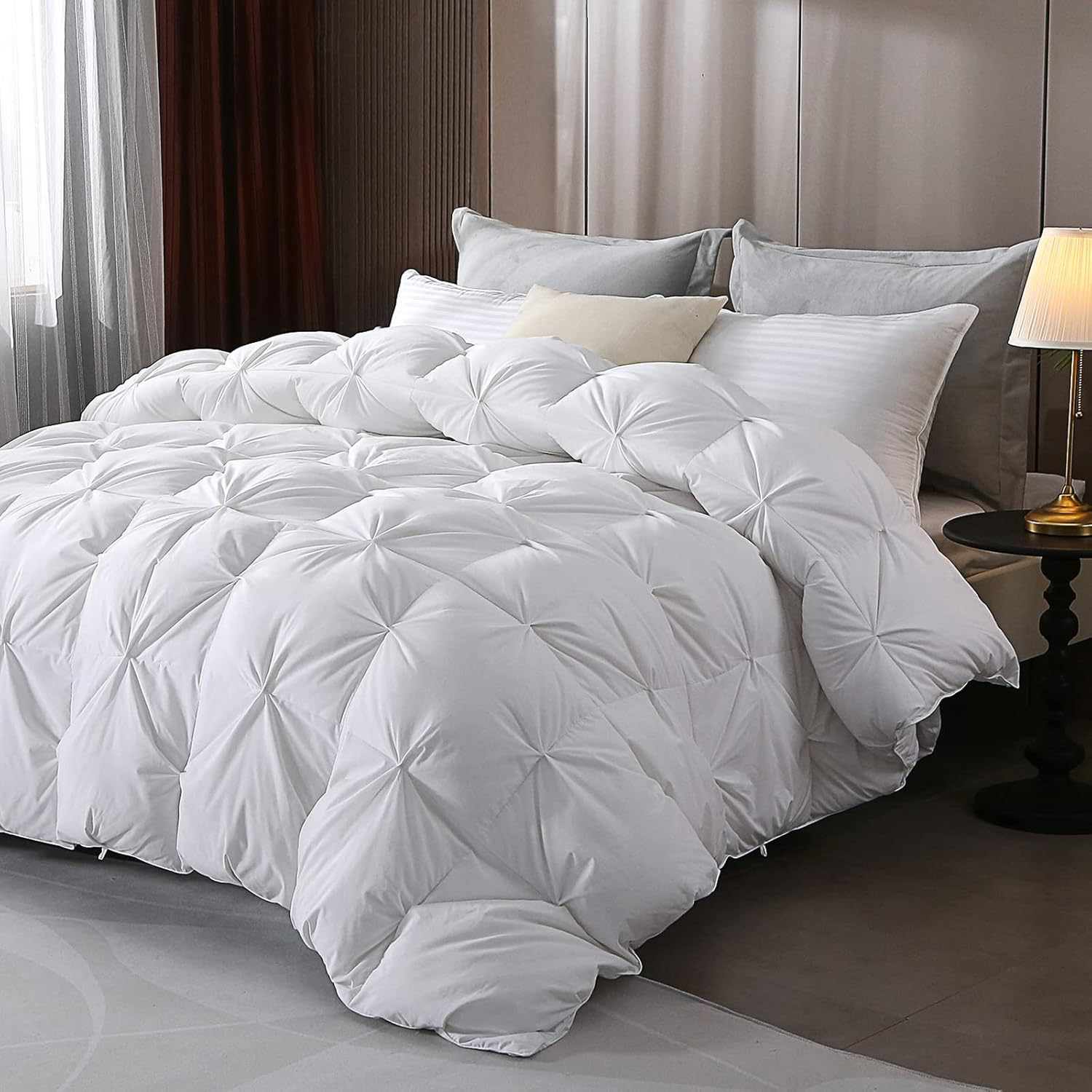 Close-up of an APSMILE Pinch Pleat comforter in white, styled on a bed with matching pillows.