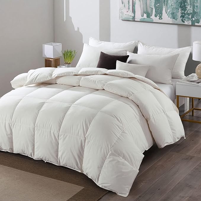 APSMILE white down comforter with accompanying pillows on a neatly made bed.