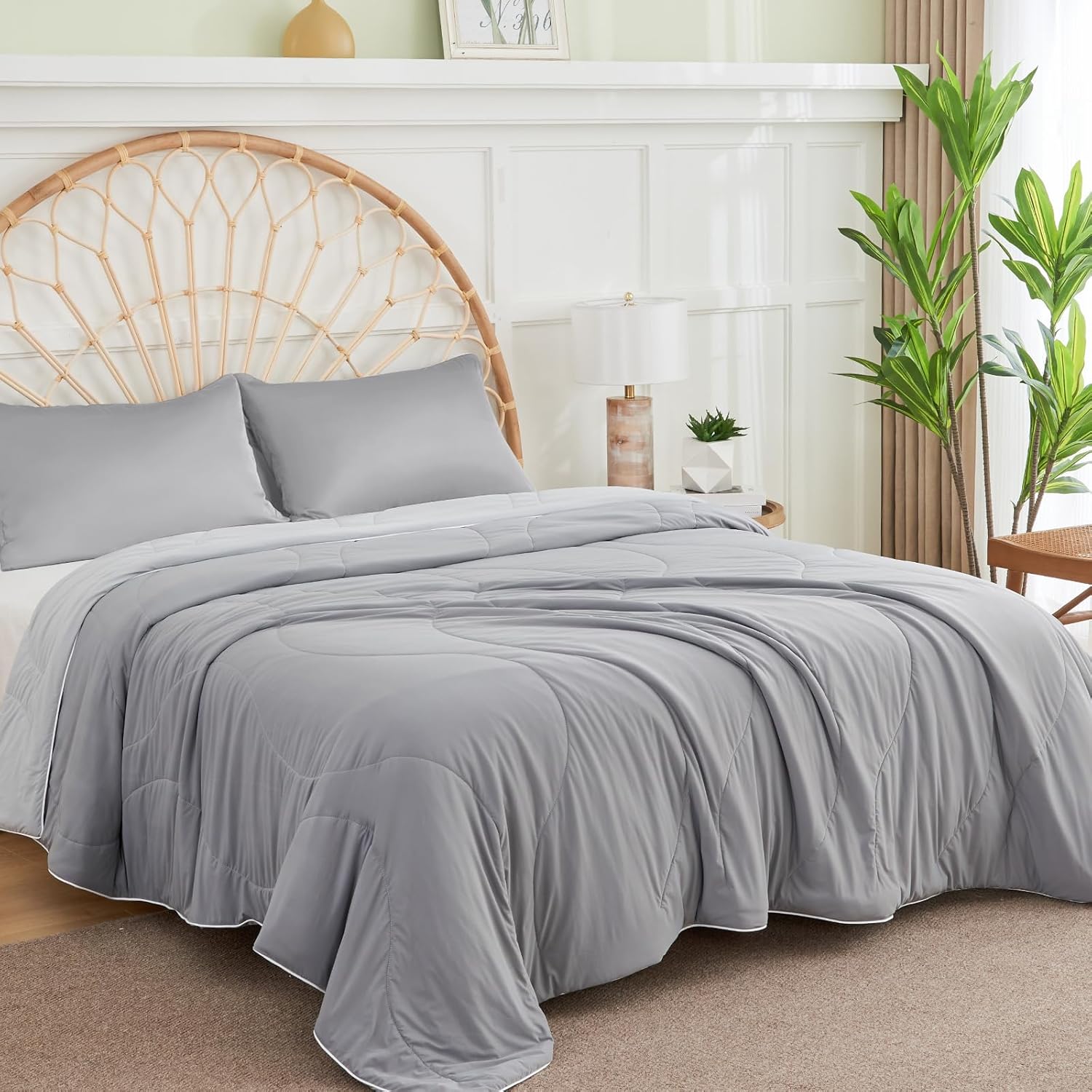APSMILE grey cooling blanket with white trim on a bed.