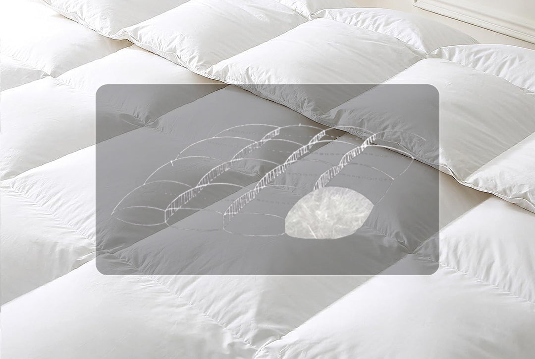 Close-up of a white APSMILE goose down feather comforter, depicting a cutaway view revealing the premium down filling.  